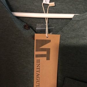 Olive green Nitagut T with tags on it.